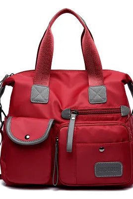 Red nylon women's large capacity shoulder bag with multiple pockets, waterproof material, casual crossbody style, suitable