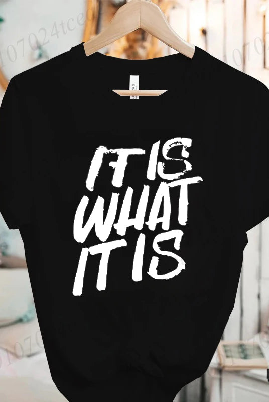 Black women's short sleeve T-shirt with IT IS WHAT IT IS funny sarcastic quote graphic, perfect for summer fashion.