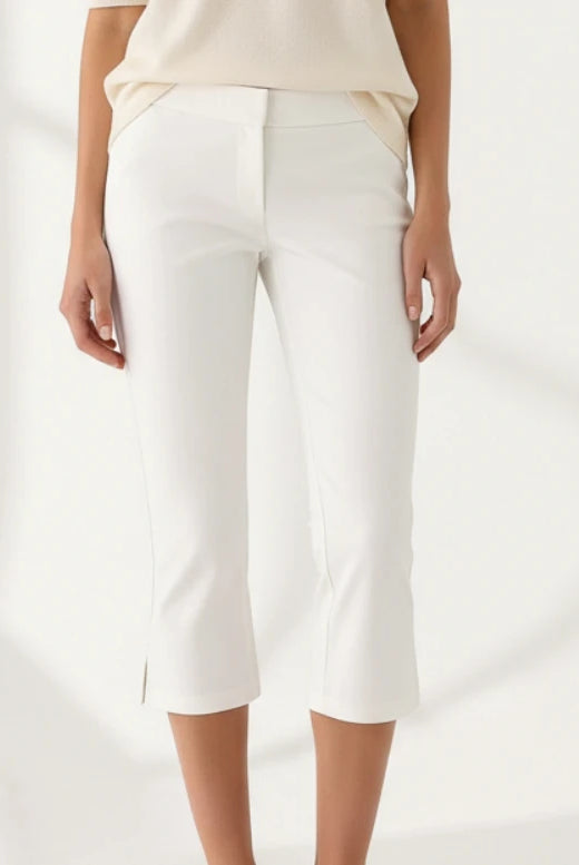 Women Summer Capri Pants casual low waist slim fit cropped trousers in solid white with dot print detail.
