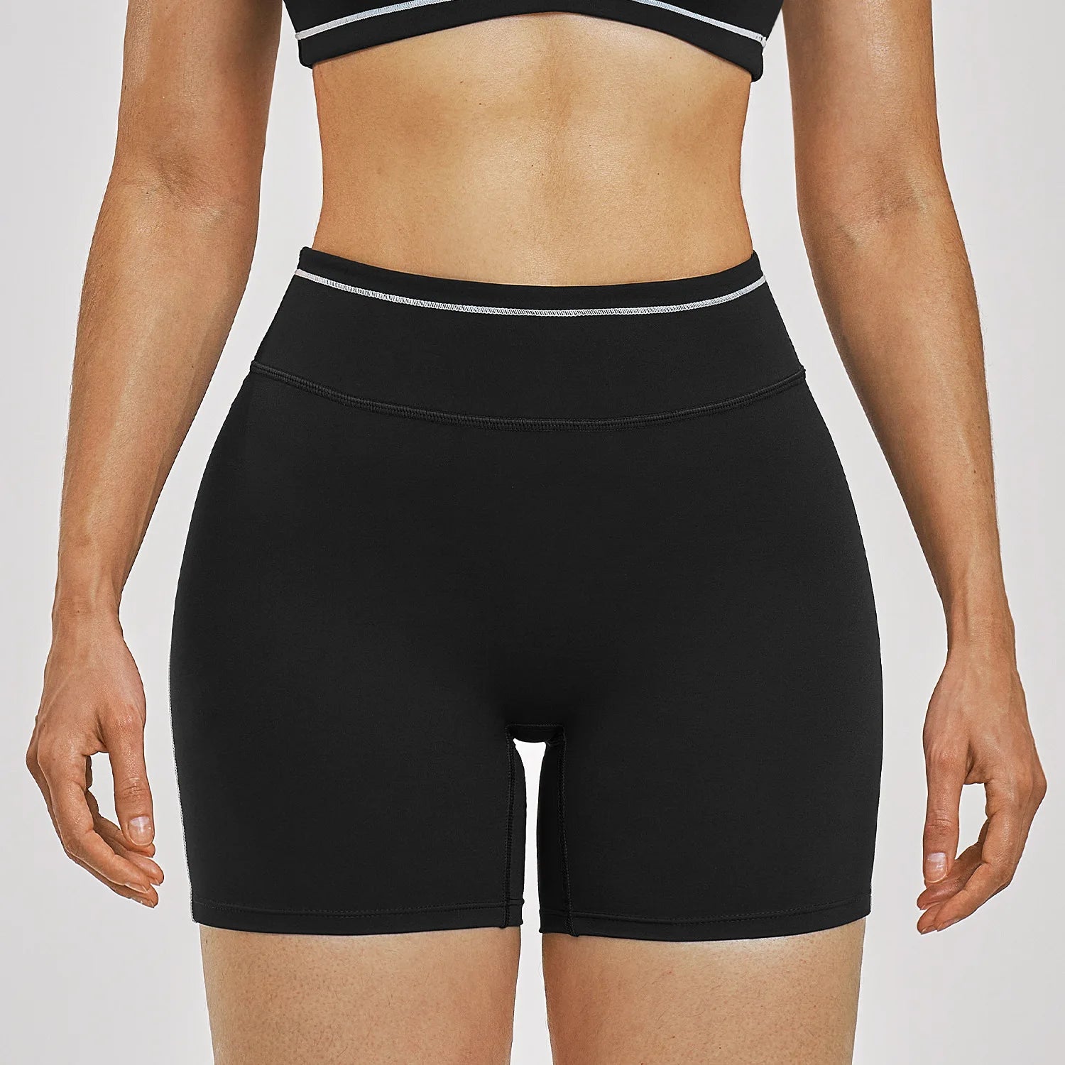 Women Running Sports Shorts Buttock Lift Gym Leggings Women Summer Shorts Cycling Slim Fit Workout Shorts High Waist Yoga Shorts in black with white trim.