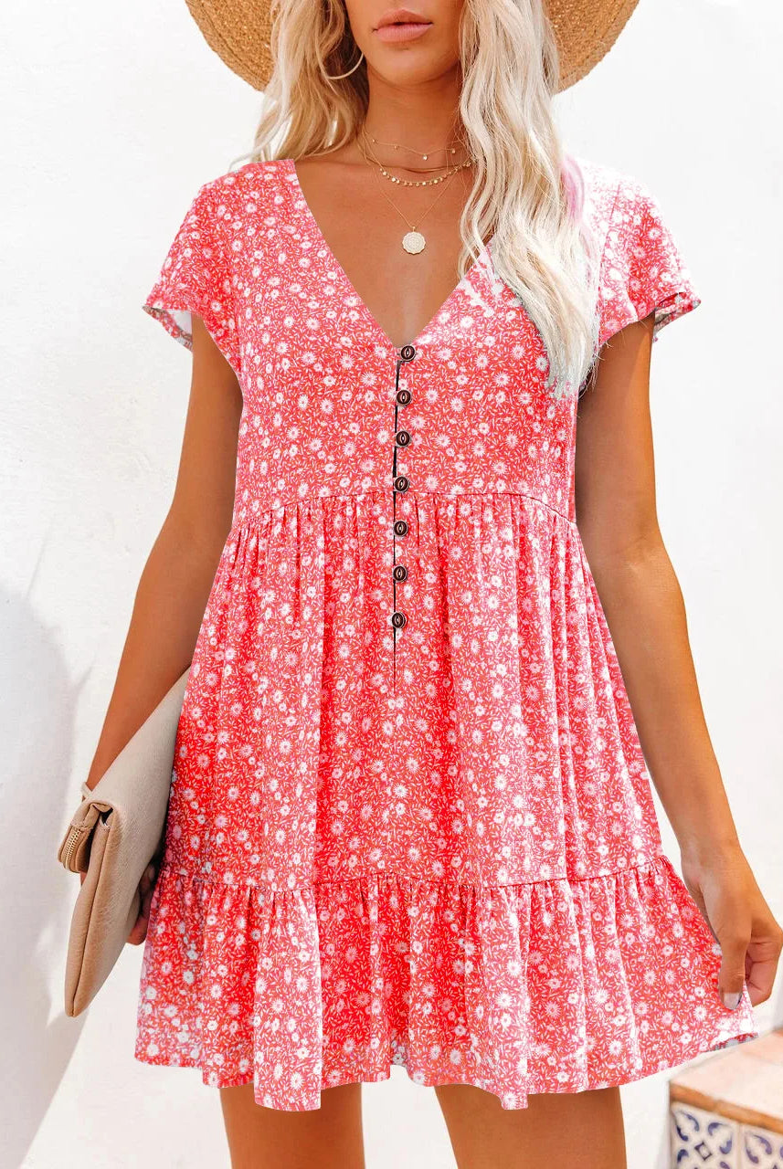 Women's spring and summer loose V-neck button floral dress with short sleeves, in pink and white, made of lightweight fabric.