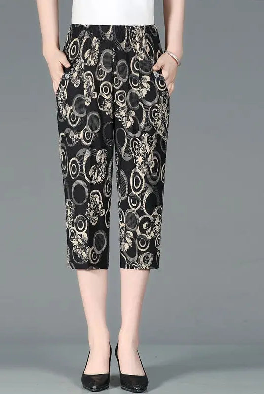 Summer New High Waist Capri Pants with elastic waist, patchwork floral print, loose straight fit, and pockets for women.
