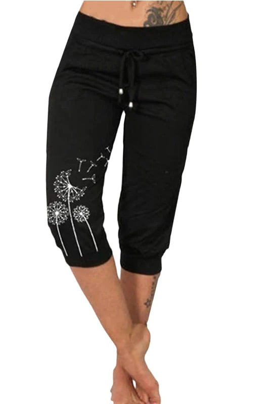 Fashion Mid-calf Lady Capri Pants 2023 Summer drawstring cropped pants with pockets, black with dandelion floral design, suitable for outdoor sports.