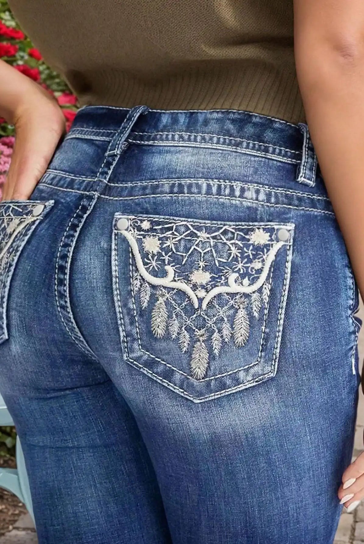 Women's Embroidered Wash Denim Jeans showing back pocket with white embroidery and heavy-duty stitching for style and