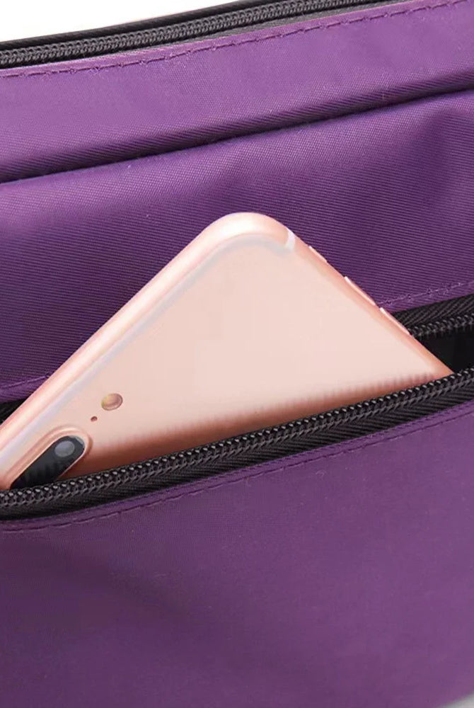 Leisure Purple One Shoulder Crossbody Bag with large capacity floral letter series printing, shown with a pink smartphone in