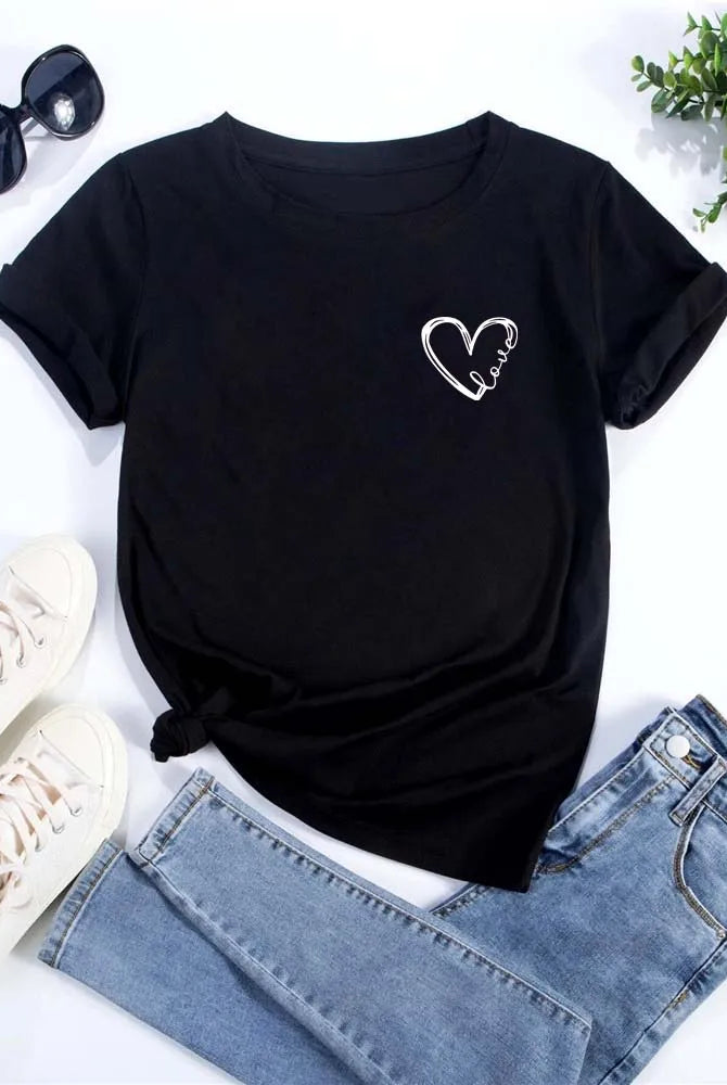 Love Heart Printed Trend Women Fashion Clothing Graphic T-shirt featuring a white heart and love text on black short sleeve casual tee, paired with light blue jeans and white sneakers.