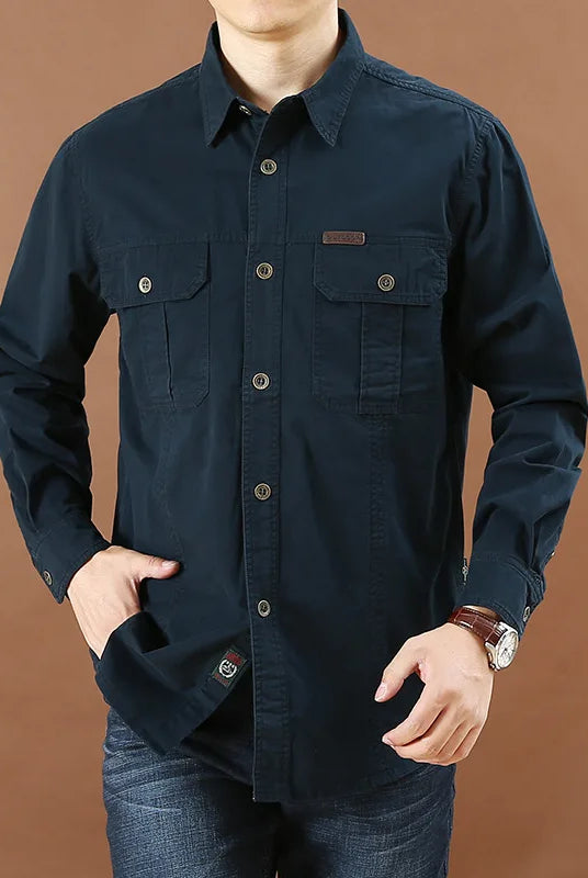 100% cotton high-quality men's long-sleeve casual shirt in solid dark blue with multiple pockets, suitable for spring and fall fashion.