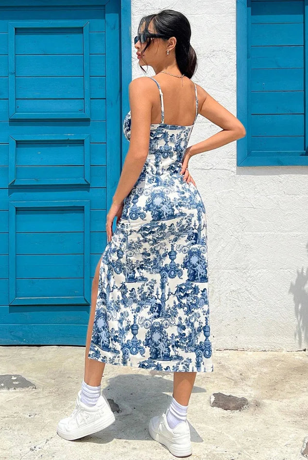 Fall 2025 Long Dress Strapless Wrap Chest High Slit Daisy Leopard Print Wrap Around Skirt Maxi Dress worn by a woman outdoors with blue shutters, white sneakers, and sunglasses.