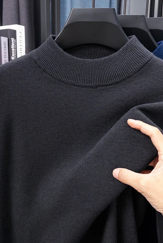 Half turtleneck knitwear sweater in solid black with ribbed mock neck, designed for casual men's autumn and winter wear.