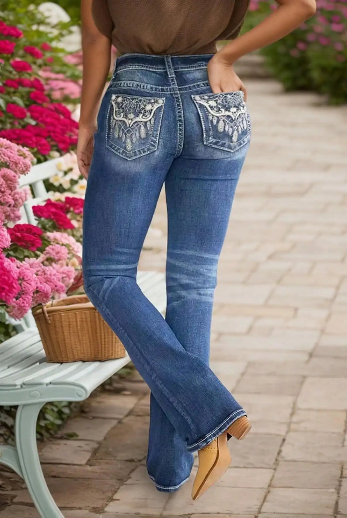 Women's Embroidered Wash Denim Jeans with heavy-duty stitching, styled for durability and fashion, shown on a woman outdoors.