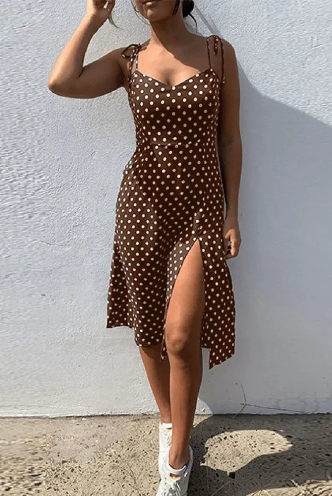 Brown polka dot summer sundress with sleeveless design, high pleated elastic waist, V-neck, and thigh-high slit, ideal for