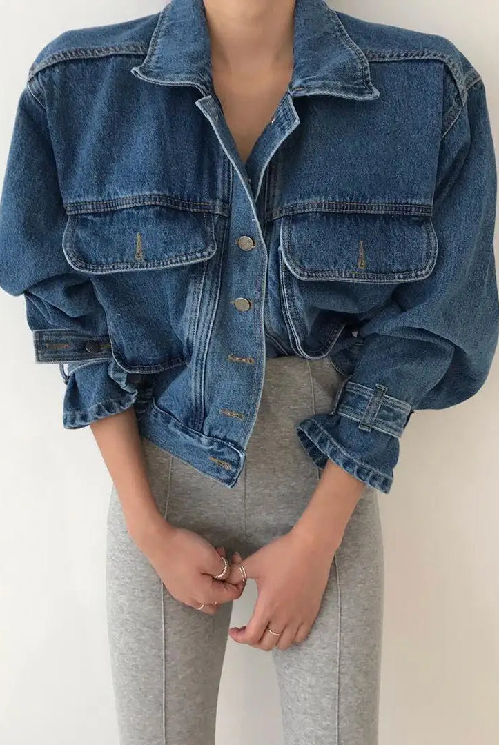 Womens blue denim cropped jacket with puff long sleeves, Y2K streetwear style, paired with gray leggings.
