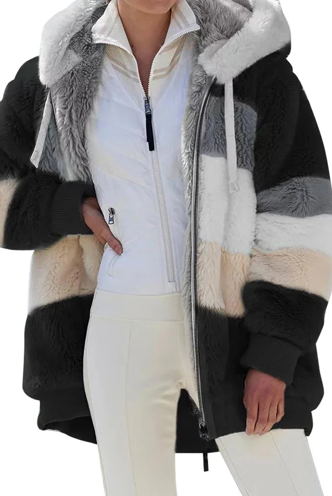 Oversized women's coat for autumn winter 2025 featuring plush material, hood, pockets, and zipper, ideal for streetwear and casual wear.