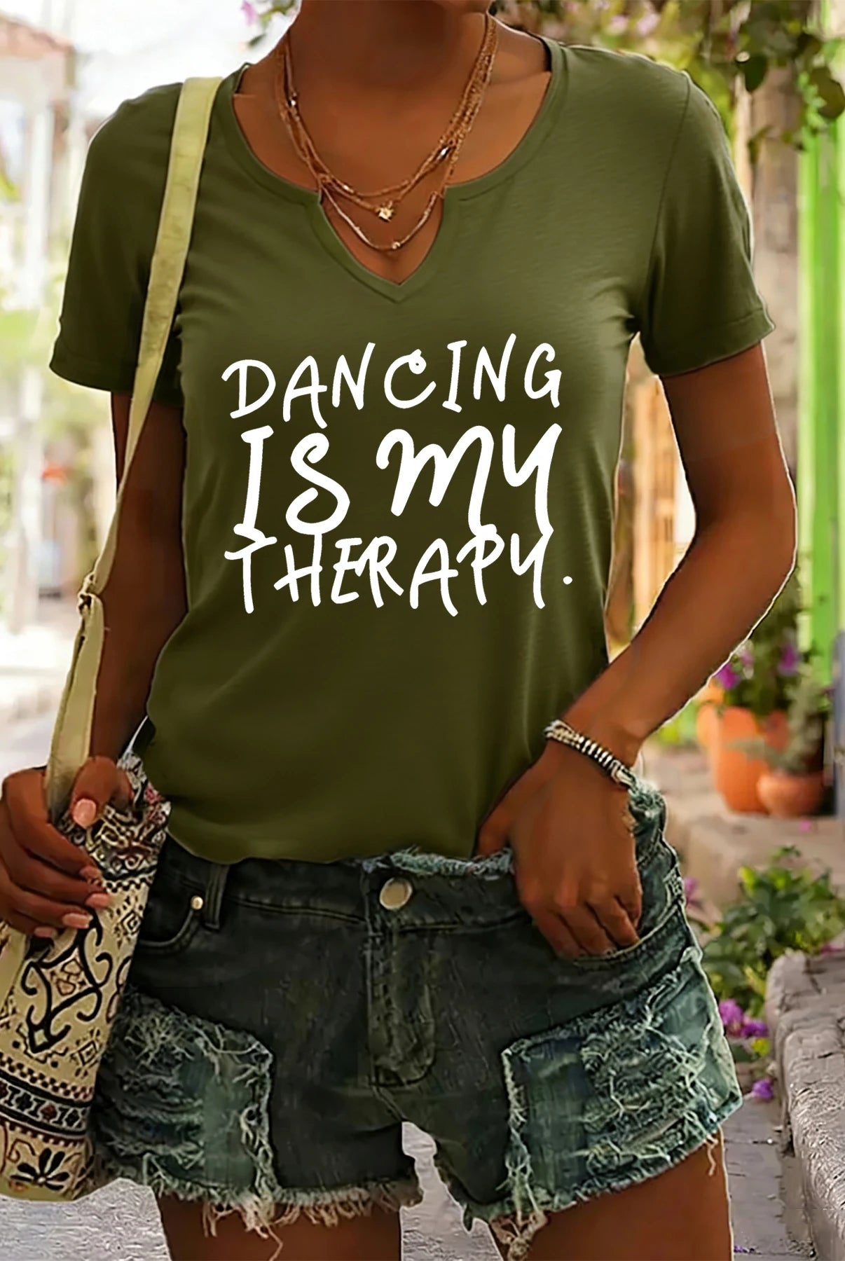 Women's summer V-neck short sleeve T-shirt with Dancing Is My Therapy slogan print, casual dance lover top in olive green.