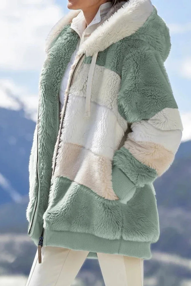 Oversized women's coat for autumn winter 2025 featuring plush fabric, hood, pockets, and zipper in neutral tones, suitable for streetwear.