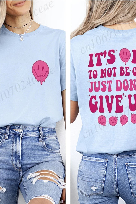 Casual women's summer T-shirt in light blue with motivational message and pink skull graphic, made of breathable fabric