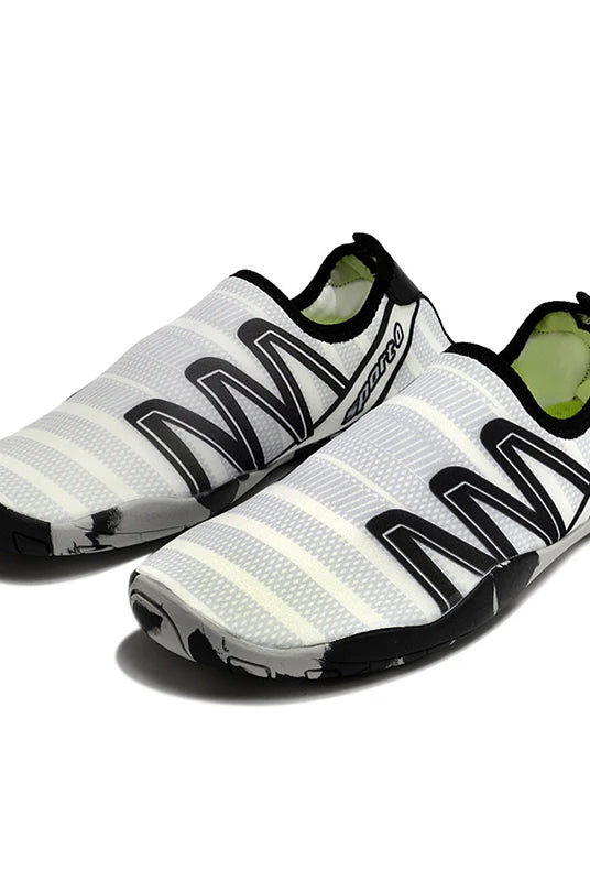 Lager Size Unisex Outdoor Aqua Shoes in white and black with flexible sole, suitable for beach, barefoot swimming, indoor fitness and gym use.