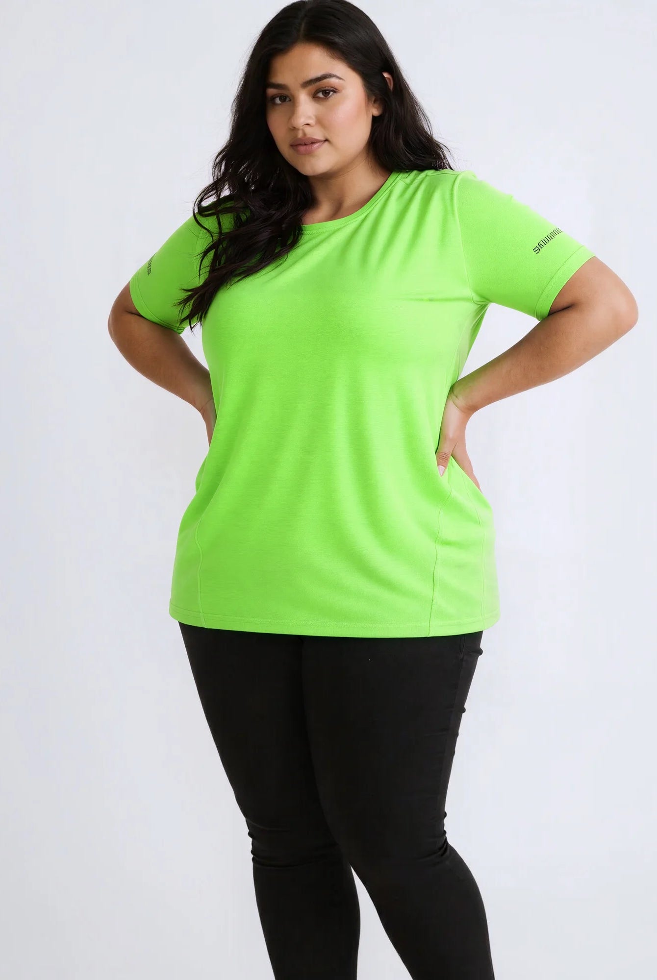 Plus size women's lime green short-sleeved T-shirt with round neckline, casual summer sports top, made of lightweight fabric.