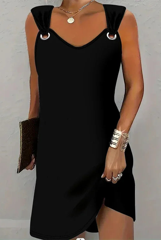 Women's fashionable casual solid color suspender dress sleeveless summer comfortable skirt worn by a woman holding a clutch.