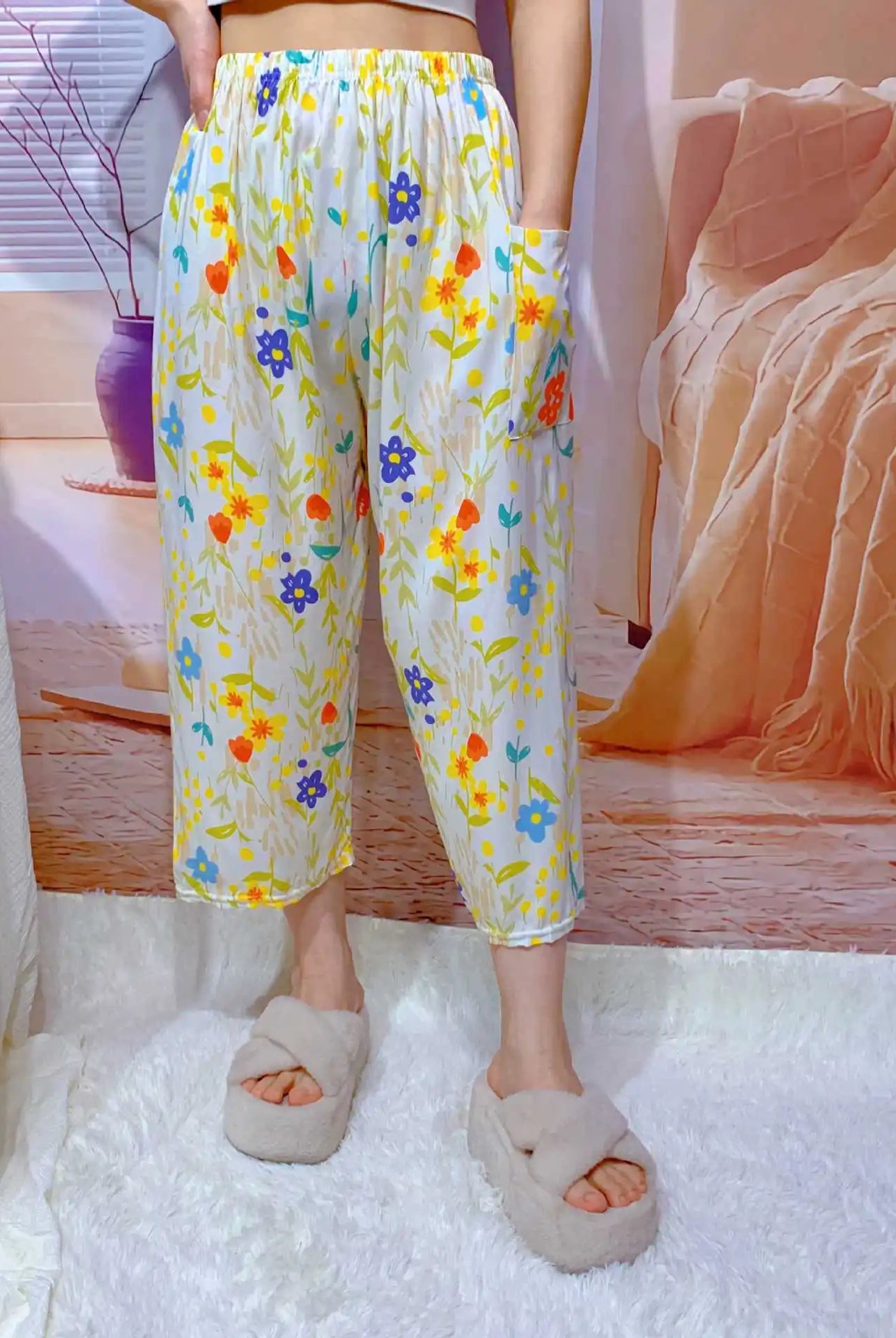 High waisted wide leg cropped Capri pants for women with colorful floral pattern, elastic waistband, and pockets, suitable