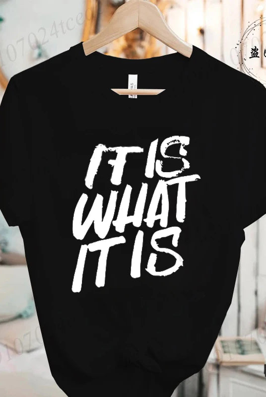 Black women's short sleeve T-shirt with IT IS WHAT IT IS sarcastic quote graphic, casual summer fashion top.