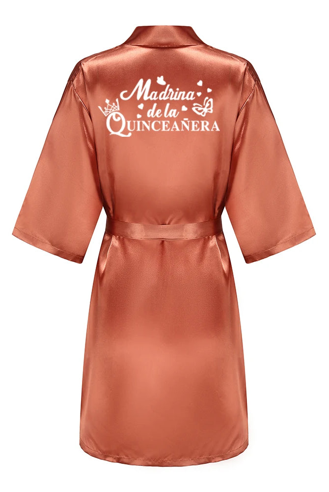 Royal blue satin Quinceanera robe with Madrina de la Quinceañera printed on the back, designed for 15th birthday celebrations.