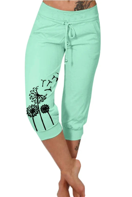 Fashion Mid-calf Lady Capri Pants 2023 Summer drawstring cropped pants with pockets, in light green with black dandelion and YETI print, suitable for outdoor sports.