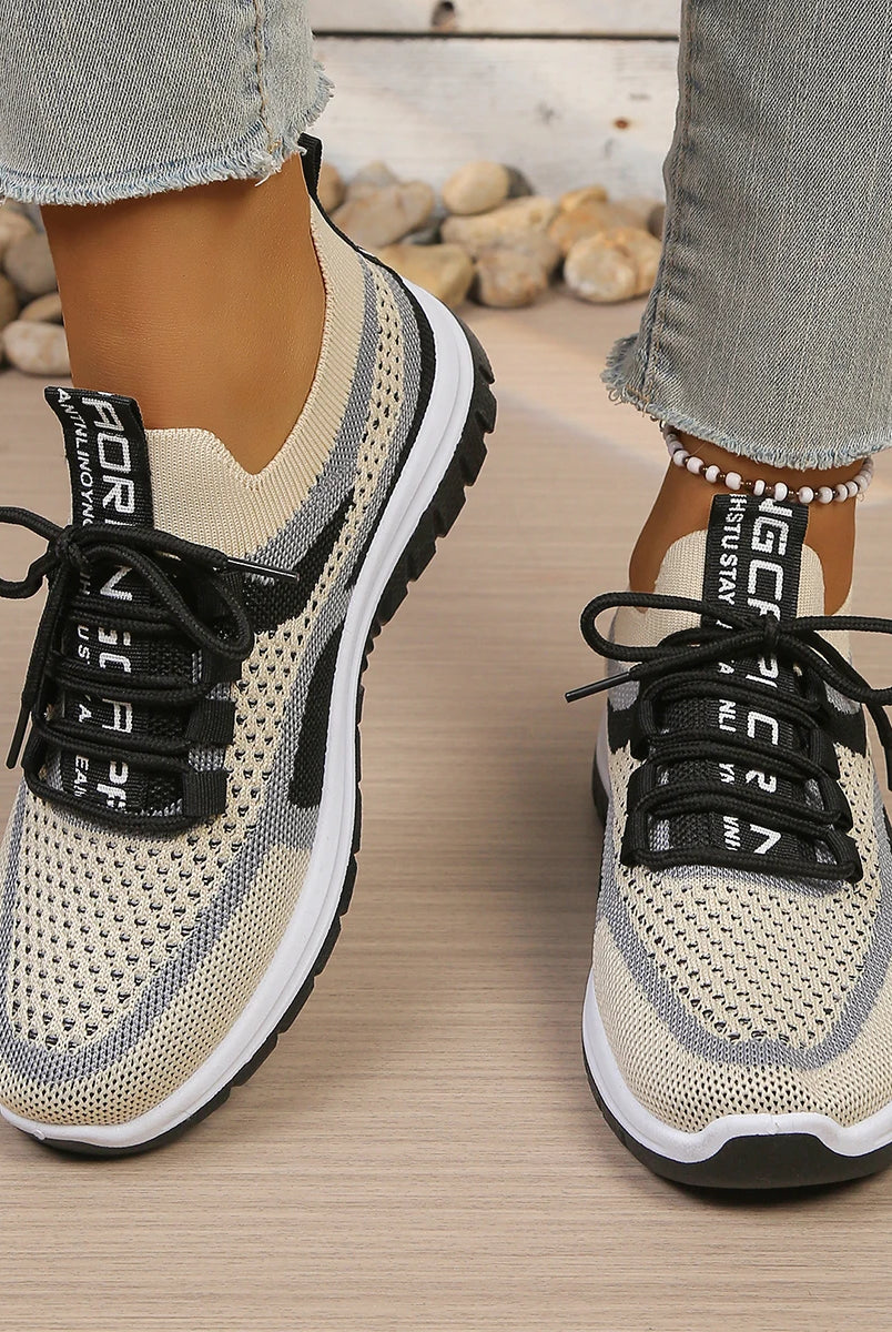 Women's summer 2026 casual sneakers with two-tone beige and black mesh upper, soft PVC sole, and black laces for comfort and
