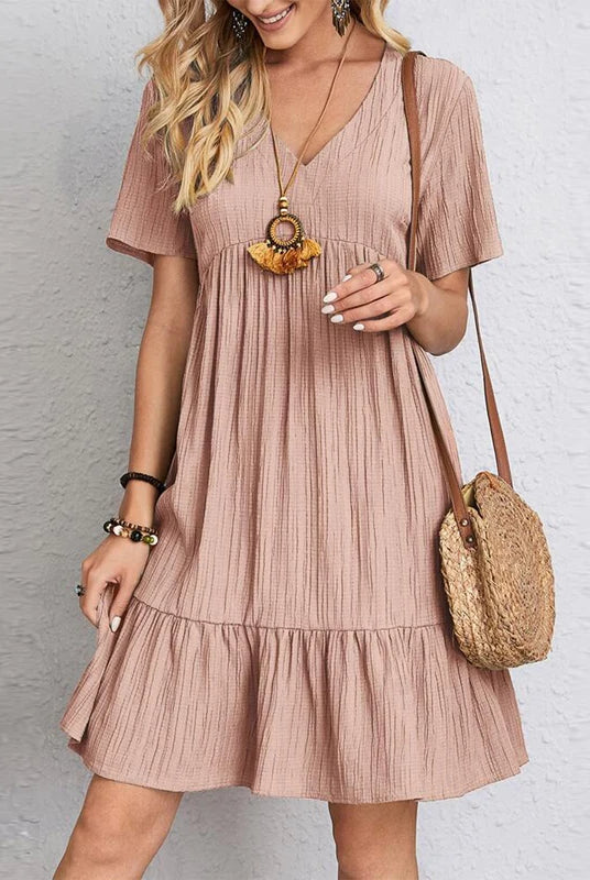 Vintage Solid Elegant Women Dress 2023 Summer Fashion Casual V-Neck High Waist A-Line Mini Dress with short sleeves in soft pink fabric.