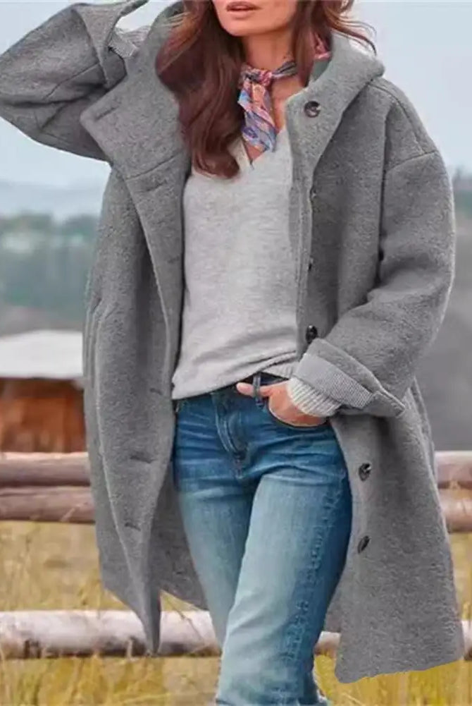 Women windbreaker jacket with hood, long sleeves, pockets, and windproof design in gray for fall and winter outdoor wear.