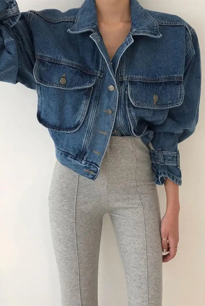 Women's blue denim cropped jacket with puff long sleeves, Y2K style, paired with light gray high-waisted leggings.