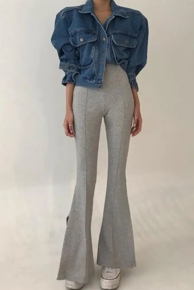 Womens Y2k cropped denim jacket with puff long sleeves, paired with high-waisted gray flared pants and white sneakers.