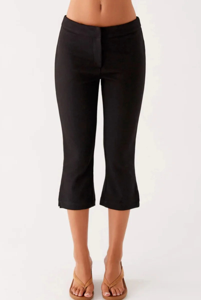 Women Summer Capri Pants Casual Low Waist Solid Color and Dot Print Slim Fit Cropped Trousers in black, lightweight fabric.