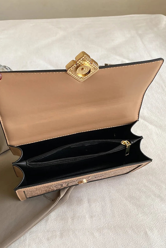Luxury purple women's single shoulder bag made of PU leather with gold hardware, featuring a spacious interior and zippered pocket.