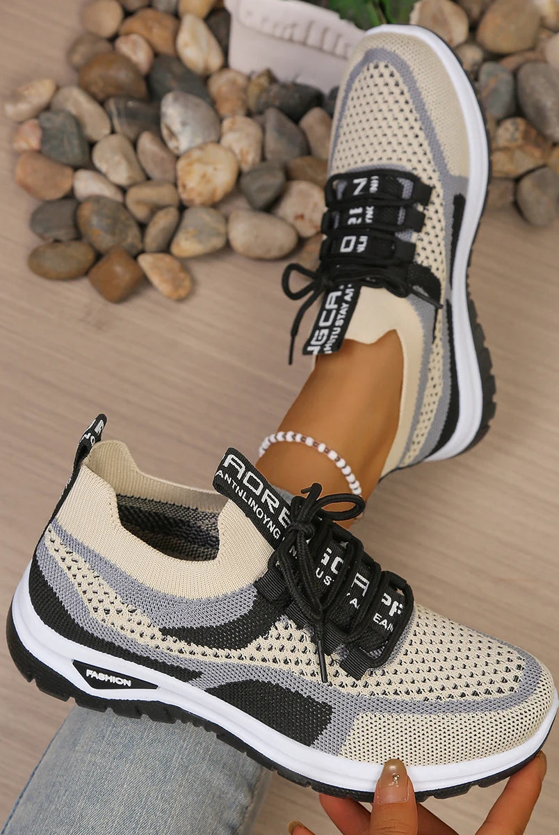 Women's summer 2026 casual sneakers with two-tone beige and black mesh upper, black laces, soft PVC sole for comfort.