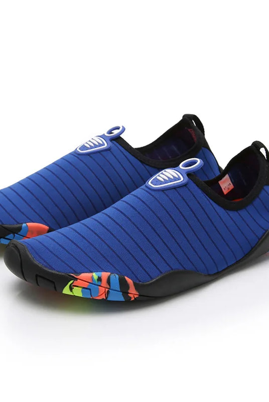 Lager Size Unisex Outdoor Aqua Shoes in blue with black soles and colorful accents, slip-on design for beach, swimming, indoor fitness, and gym use.