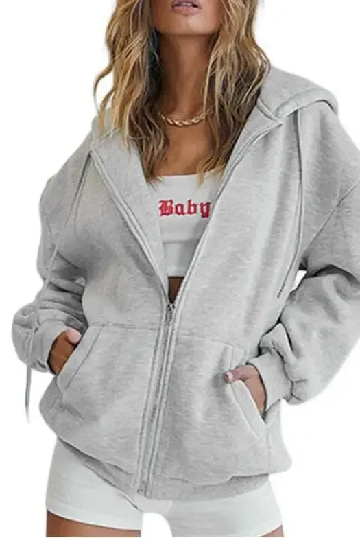 Womens gray zip-up sweatshirt jacket with hood, long sleeves, front pockets, and versatile casual style for autumn and