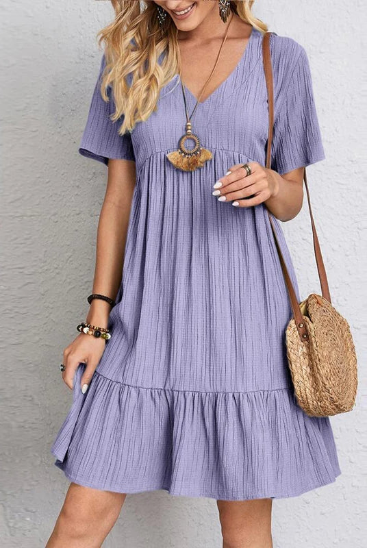 Vintage solid lavender women dress 2023 summer casual V-neck high waist A-line mini dress with short sleeves and ruffled hem.