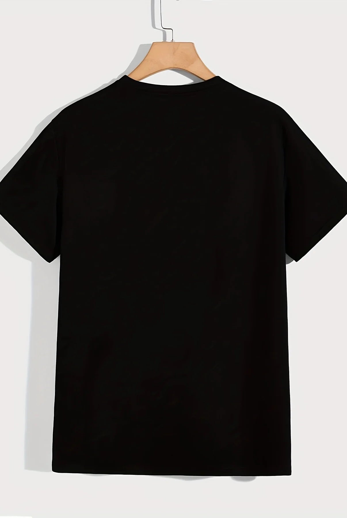 Womens T-shirt Im Not Rude letter printed casual short sleeve round neck top in black hanging on a wooden hanger.