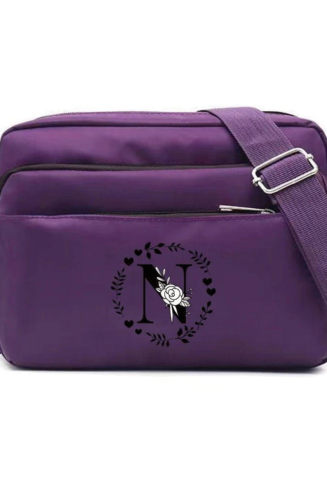 Purple One Shoulder Crossbody Bag with Garland Letter Series print, large capacity, durable fabric for commuting and storage.