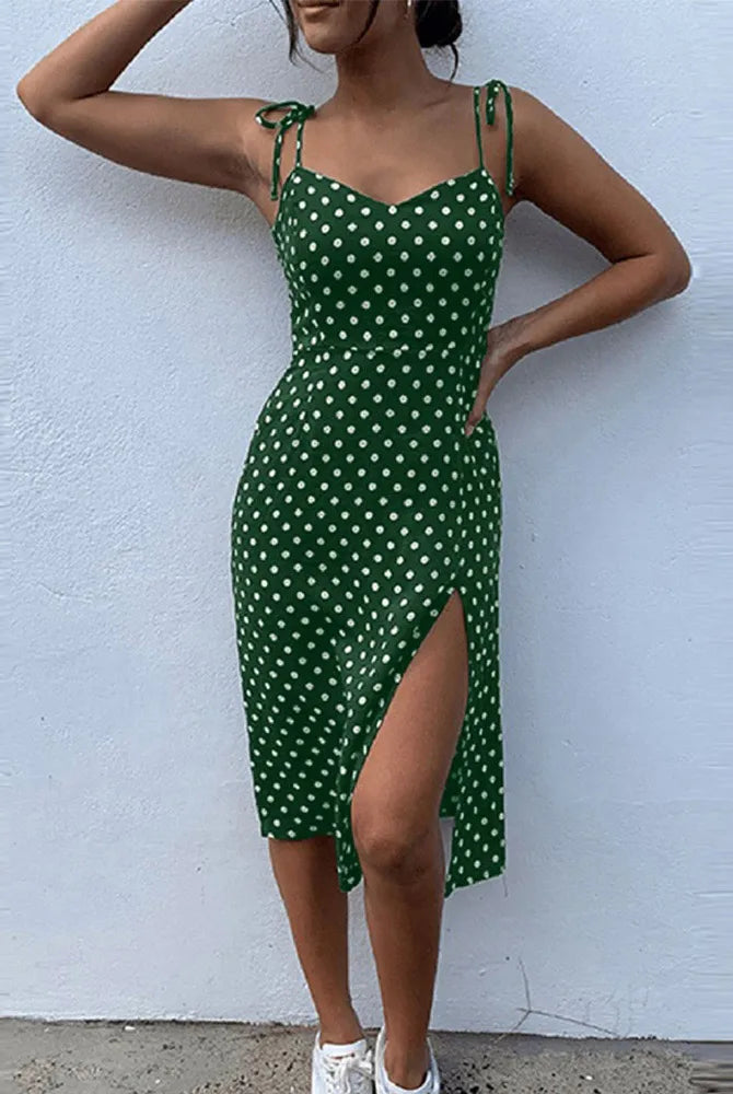 Summer womens casual polka dot sundress with sleeveless design, high pleated elastic waist, V-neck, side slit, green fabric.