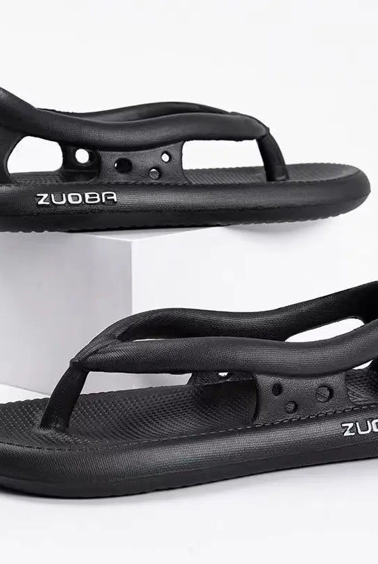 Black men's and women's summer flip-flops with thick non-slip soles, made of rubber, suitable for beach, outdoor, and casual wear.
