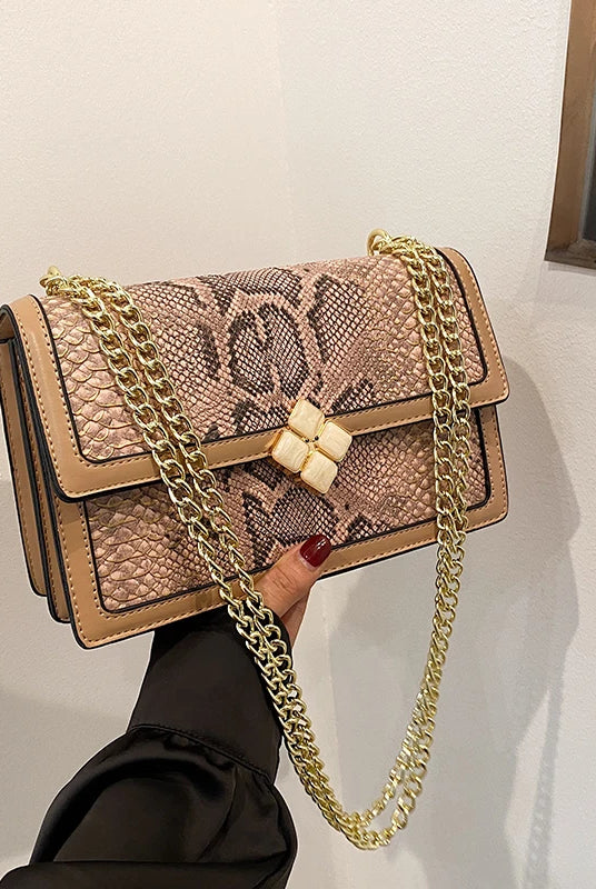 Luxury Purple Women's Single Shoulder Bag with PU leather, snake print design, gold chain strap, and decorative clasp.