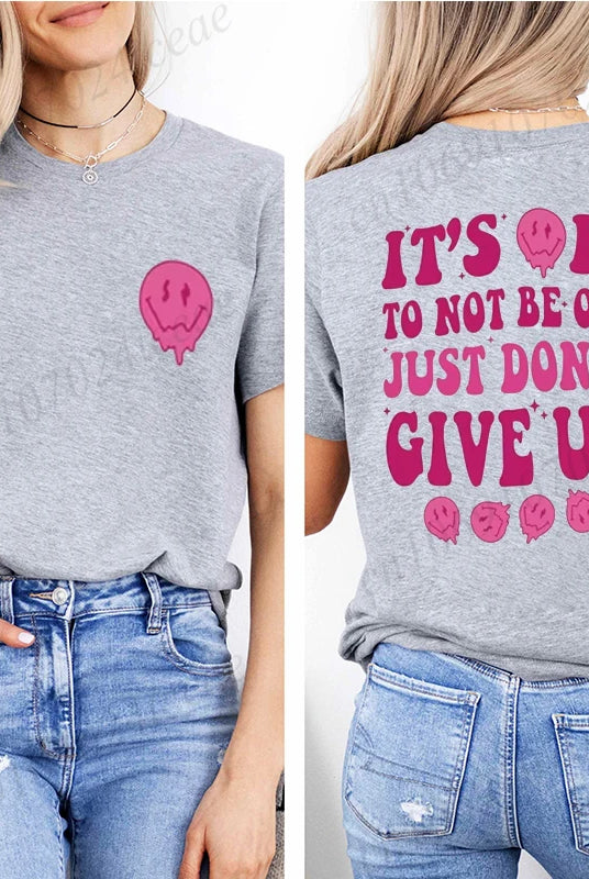 Casual women's summer T-shirt made of breathable fabric featuring a pink skull graphic and motivational message It's OK to