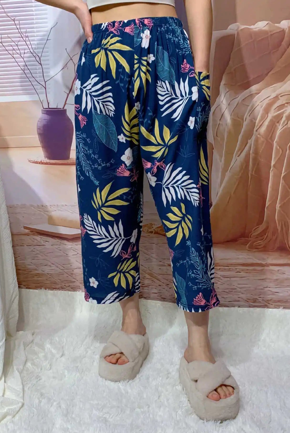 High waisted wide leg cropped Capri pants for women with tropical floral pattern, pockets, and casual summer style.