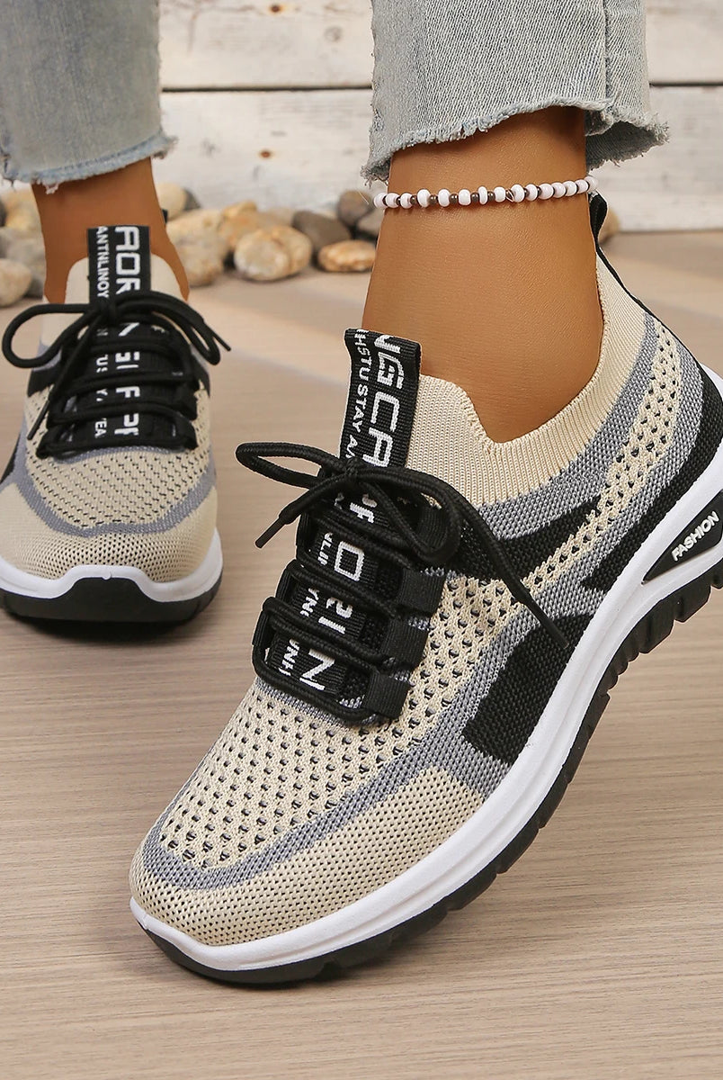 Women's summer 2026 casual sneakers with two-tone beige and black breathable mesh, black laces, and soft PVC sole for