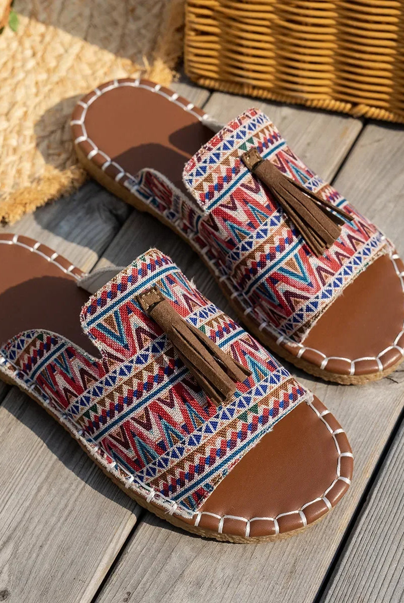 Bohemian Flat Bottom Slippers Women's outdoor summer sandals with colorful tribal pattern, tassel detail, and brown sole.