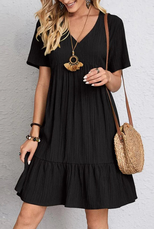 Vintage Solid Elegant Women Dress 2023 summer casual V-neck high waist A-line mini dress with short sleeves, worn by a smiling woman with accessories.