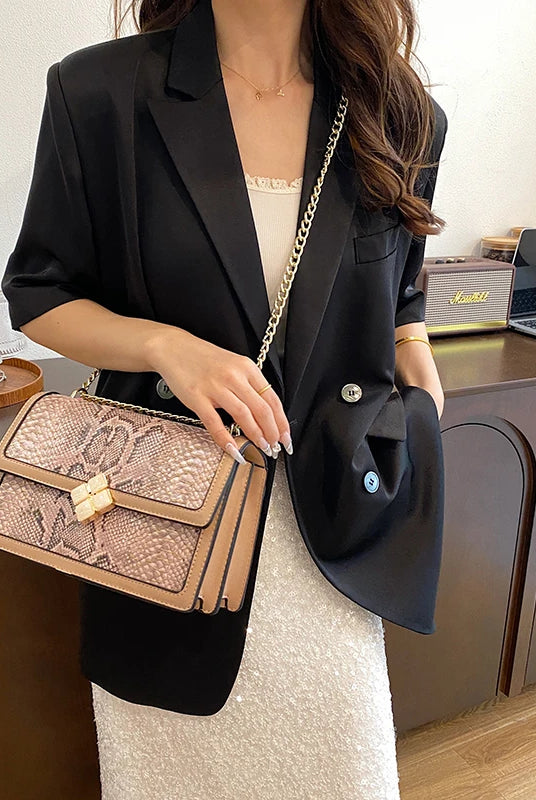Luxury Purple Women's Single Shoulder Bag with PU leather, snake print design, gold chain strap, and flap closure.