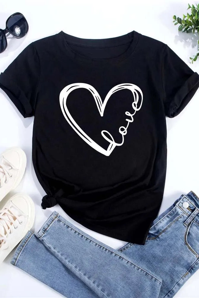 Love Heart Printed Trend Women Fashion Clothing Graphic T-shirt with white heart and love script, short sleeve casual black tee displayed with jeans and accessories.